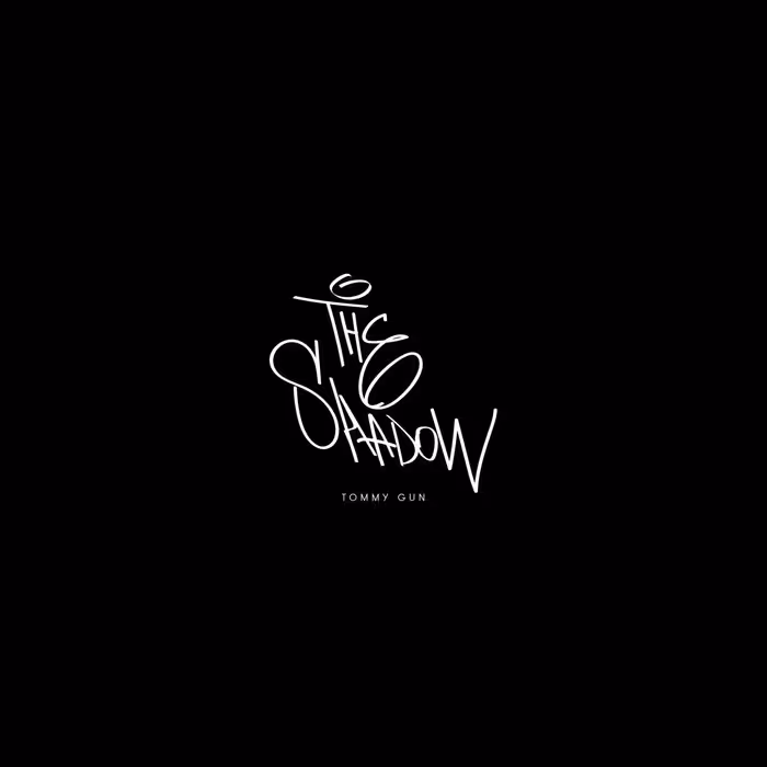 Black background with stylized white text reading 'The Shadow' above smaller text 'Tommy Gun'.
