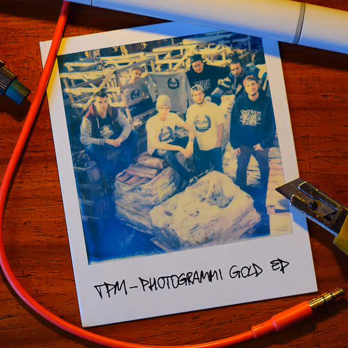 Polaroid photo of six young men in casual clothing posing with wrapped pallets in an industrial setting, captioned 'TFM - PHOTOGRAMMI GOLD EP'.